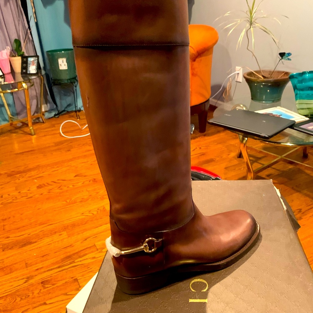 Authentic Gucci calf length boots. The calf area will only fit small legs.
